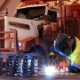 Welder working on a mining truck