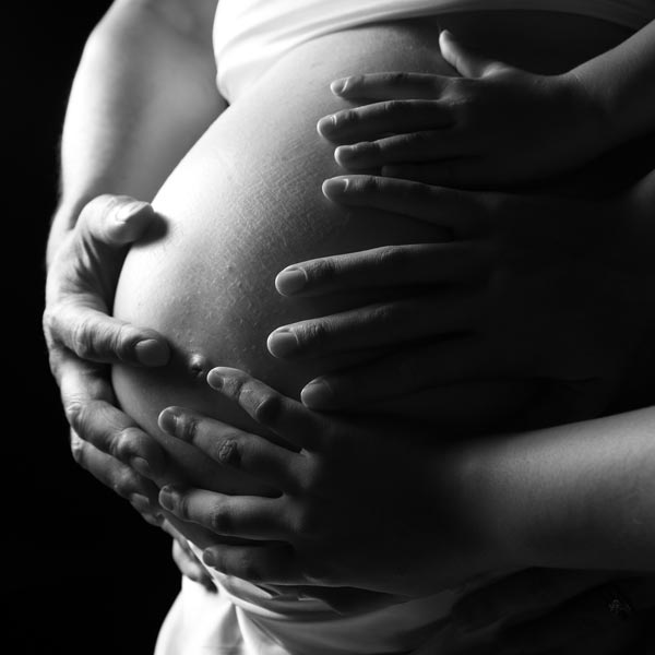 Pregnant belly photo with hands