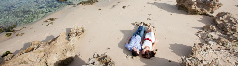 Couple lying on the beach